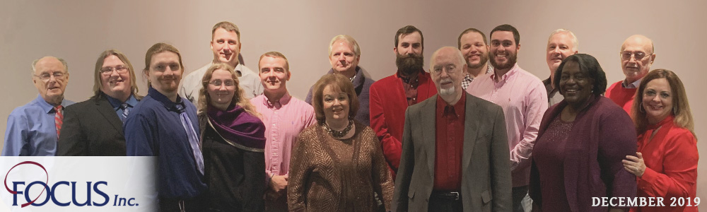 Focus Employees and Family Members pose for a group photo at the company's annual Christmas party